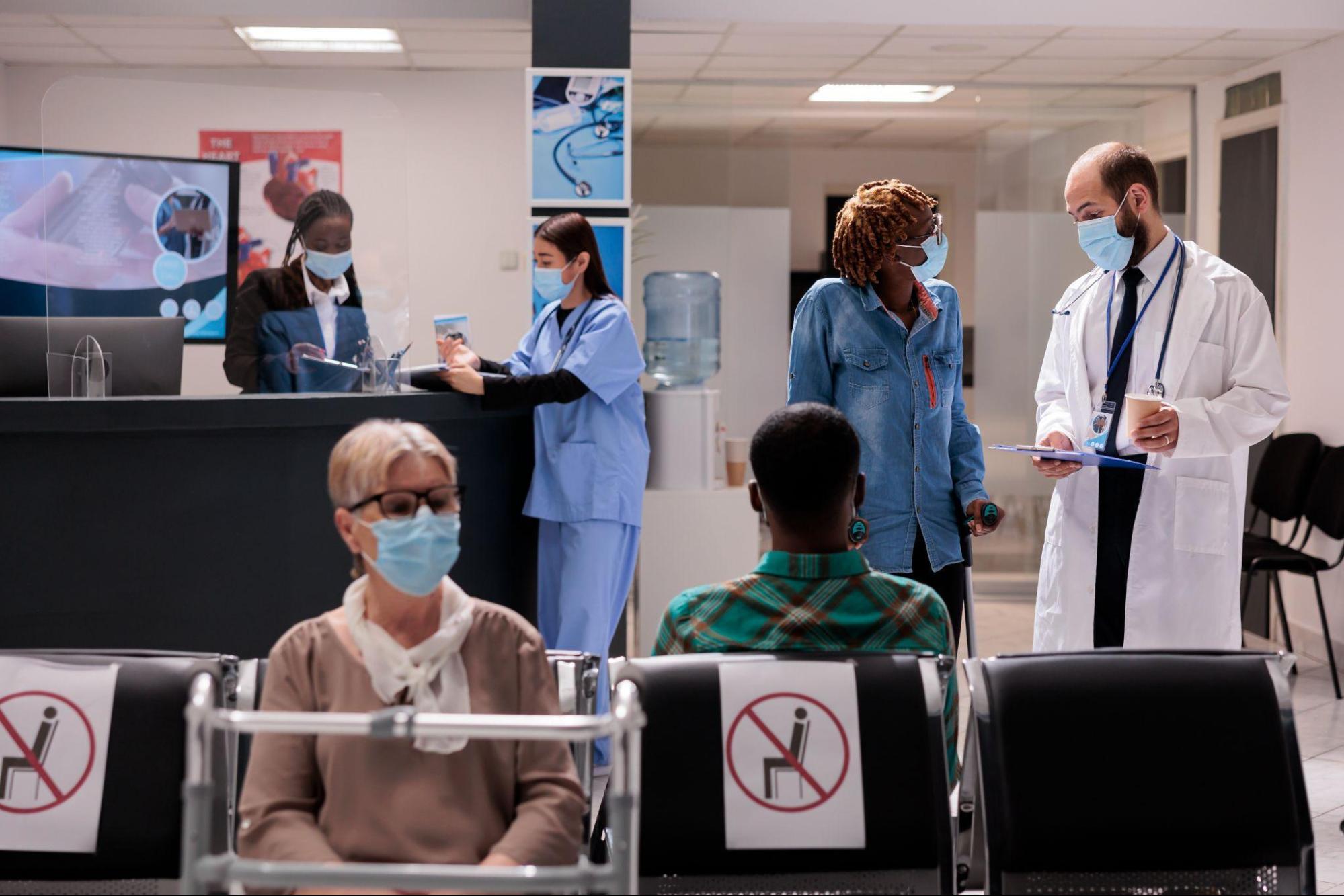 Urgent care marketing add patient flow in this center, where an old lady waits, doctor talks to another patient, & receptionist discusses reports with a nurse