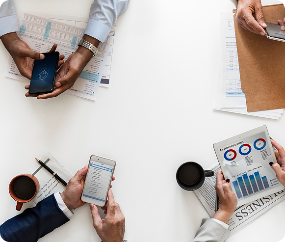 A person in a suit writes in a legal book at a desk, with a gavel and scales of justice nearby, conveying a professional legal setting.